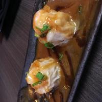 Shrimp Shumai · Steamed shrimp dumplings and teriyaki cream sauce.