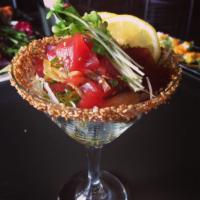Ahi Poke · Tuna, sweet onion, sesame seeds, chives, marinated in our special poke sauce, served over se...