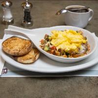Wilbur Skillet · Crushed bacon, potatoes, avocado, diced tomato, jack. Two eggs your way, English muffin.