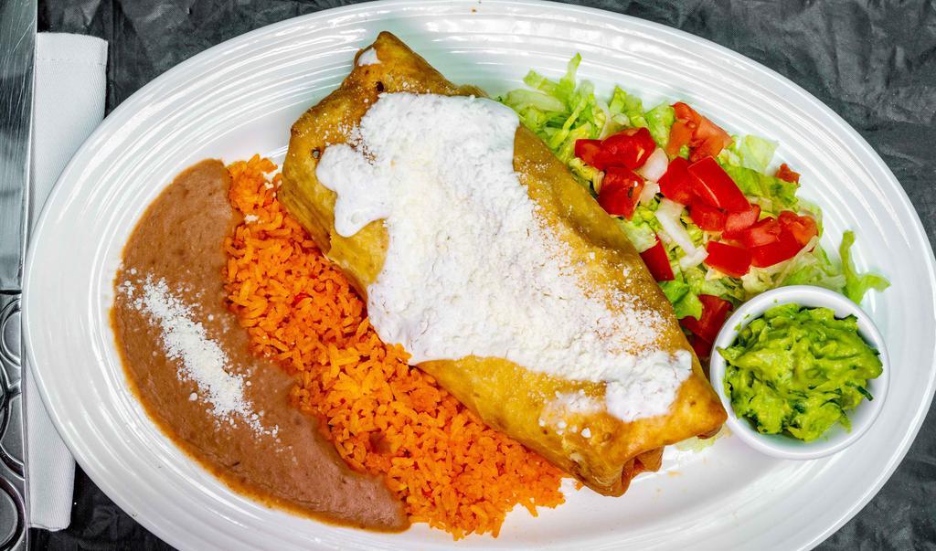 Chimichangas · Fried burrito stuffed with shredded chicken or beef - served with sides of our traditional Mexican rice and refried beans topped with side salad, pico de gallo, sour cream and guacamole