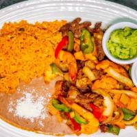 Shrimp Fajitas · Fresh grilled shrimp cooked with onions, tomatoes & green ppers - served with Mexican rice a...
