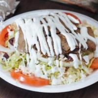 Gyro Salad · Sliced rotisserie beef and lamb mix, on Greek salad, garlic vinaigrette with tzatziki, feta ...