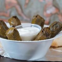 6 Stuffed Grape Leaves · Vegetarian grape leaves stuffed with rice, parsley and spices, served with tzatziki. 