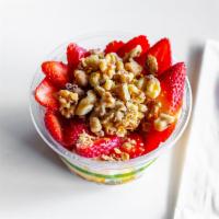 Frozen Yogurt Bowl · Topped with strawberries, strawberry frozen yogurt, almond granola, pepitas, walnuts, raisin...