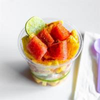 Tajin Salad  · Watermelon, jicama, cucumber, orange, coconut, pineapple topped with tajin and lime.