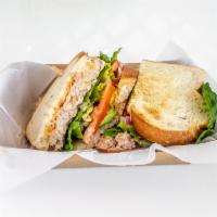 Tuna Sandwich · Tuna, chipotle mayonnaise, mozzarella cheese, lettuce, tomato, red onions and avocado.