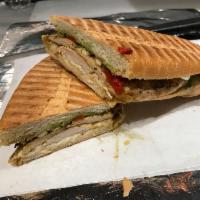 Grilled Chicken Panini · Roasted peppers, mozzarella and balsamic pesto sauce.