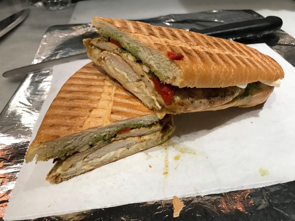 Grilled Chicken Panini · Roasted peppers, mozzarella and balsamic pesto sauce.