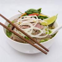 2. Eye Round Noodle Soup-Thin Sliced Steak · Beef noodles soups served with fresh bean sprouts, sweet basil, jalapenos, and a wedge of li...