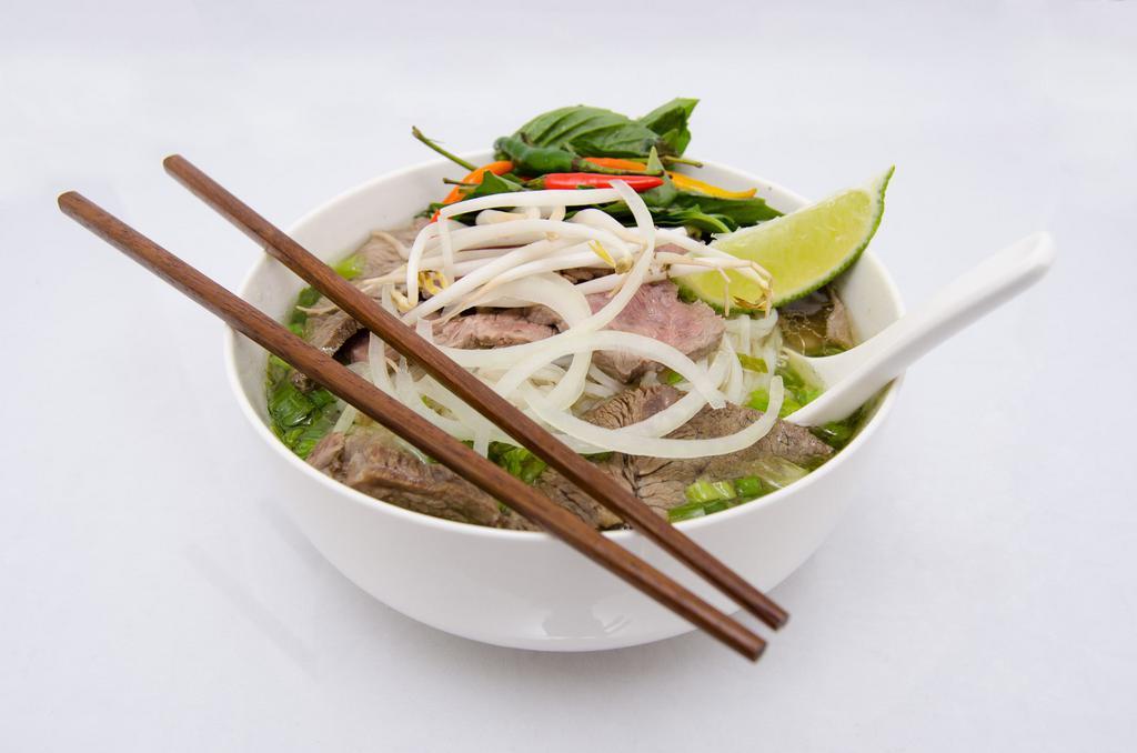 3. Flank Noodle Soup-Well Done Flank Steaks · Beef noodles soups served with fresh bean sprouts, sweet basil, jalapenos, and a wedge of lime.