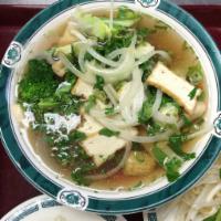 6. Tofu, Mushroom & Vegetable Noodle Soup · Beef noodles soups served with fresh bean sprouts, sweet basil, jalapenos, and a wedge of li...