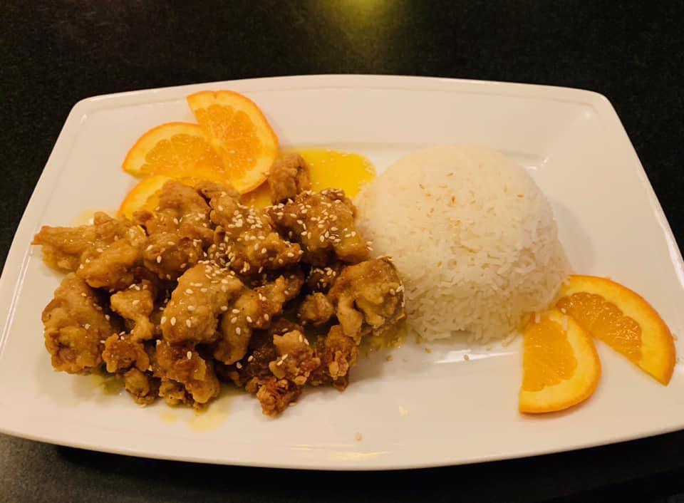 8. Orange Chicken · Served with rice. Lightly breaded chicken drizzled with orange glaze.