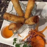 3. Egg Rolls · 5 pieces. Fried vegetarian roll of cabbage, carrots and glass noodles. Served with sweet sau...
