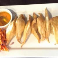 4. Cream Cheese Wonton · Cream cheese in wonton skin. Served with sweet and sour sauce.
