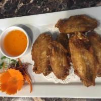 12. Fried Chicken Wings · Deep fried marinated chicken wings. Served with sweet chili sauce.