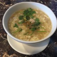 17. Egg Drop Soup small · Chicken, onions, egg, peas and carrots.
