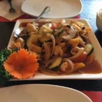 53. Sweet and Sour · Pineapple, cucumbers, tomatoes, onions, green onions and mushroom. Served with steamed jasmi...