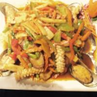 56. Pad Ped · Stir fried Thai red curry paste with bamboo shoots, bell peppers, eggplant, carrots, lime le...