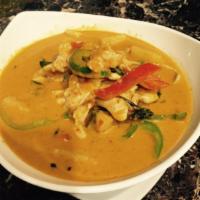45. Panang Curry · Coconut milk, bell peppers, pineapple and Thai basil in panang curry paste.
