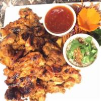 64. Thai BBQ Chicken · Lemon grass, garlic and ginger marinated chicken and easily grilled to perfection. Served wi...