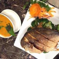 71. Pompano · Whole fish. Deep fried pompano. Topped with choice of panang curry sauce or hot basil sauce.