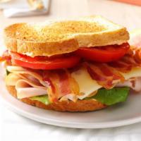 B.L.T. Sandwich · Bacon, lettuce, tomato, and mayo. 
Served with a side.