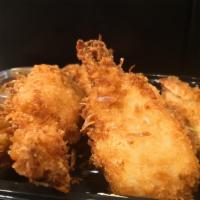 5 Pieces Crispy Coconut Shrimp  · Golden sweet, crispy coconut crusted shrimp served with our homemade sweet and spicy pineapp...