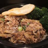 Kalua Pig Bowl · Traditional Hawaiian slow oven-roasted smoky pork served with cabbage and onion