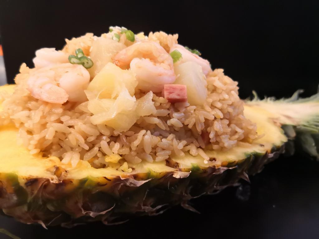 Makana House fried rice · Hawaiian style rice stir-fried in our homemade special sauce  with pineapple, shrimp, spam, eggs and green scallion.