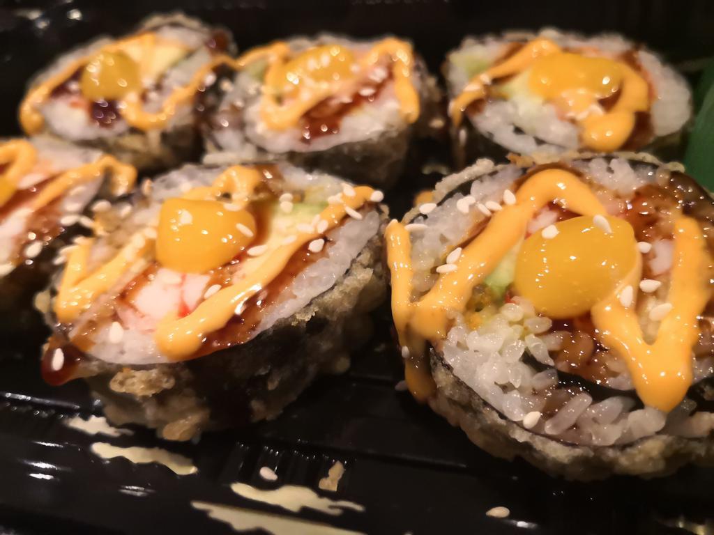 6 Pieces East Harlem Roll · Tempura fried spicy crabmeat, avocado, cucumber with tropical fruit sauce.