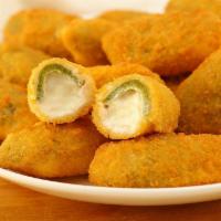  Jalapeno Poppers · 6 Large Cream Cheese Stuffed Jalapeno's breaded to  a light crisp served with a side of mari...