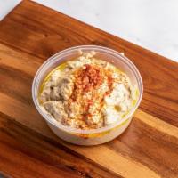 Baba Ghanoush · A blend of ground fire-roasted eggplant with tahini, garlic, and extra virgin olive oil. Glu...