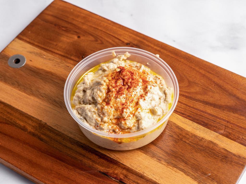 Baba Ghanoush · A blend of ground fire-roasted eggplant with tahini, garlic, and extra virgin olive oil. Gluten-Free