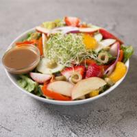 Garden Salad · Salad topped with alfalfa sprouts, olives and seasonal fruits. Served with romaine, spinach,...