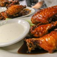 Buffalo Wings  · Cooked wing of a chicken coated in sauce or seasoning.