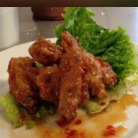 A4. Oo-La-La Wings · 5 pieces. Bangkok street vendor fried chicken wings lightly mixed with sweet and tangy sauce.