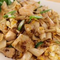 L4. Pad Krua Gai · Wide rice noodles stir-fried with protein of choice, roasted garlic, bean sprouts, cabbage a...
