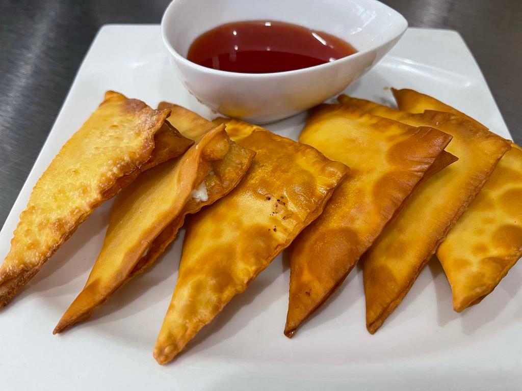 A7 Moon Crab · Mixed imitation crab meat, cream cheese, and green onion wrapped in Wonton sheet served with sweet chili sauce.