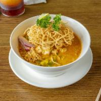 N5 Kao Soi  · Egg noodle with shallot, onion, and pickle cabbage topped with crispy noodle in curry sauce.