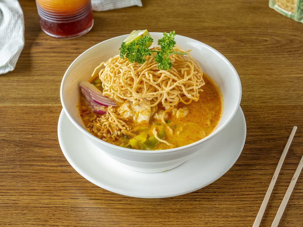 N5 Kao Soi  · Egg noodle with shallot, onion, and pickle cabbage topped with crispy noodle in curry sauce.