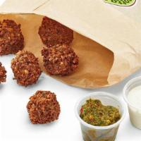 Falafel (6 Pieces) · Seasoned ground chick peas with parsley, fried to crispness with pita bread.