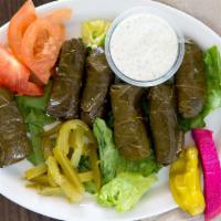 Stuffed Grape Leaves (6 Pieces) · Fresh grape leaves stuffed with seasoned and steamed rice, served cold.