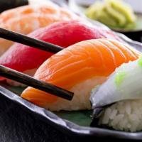 Sushi Appetizer · An assortment of tuna, salmon and white tuna. Five pieces.