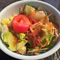 Garden Salad · Lettuce, tomatoes, carrots and cucumbers served with ginger dressing.