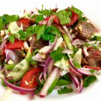 Beef Salad  · Marinated grilled beef with cucumber slices, onions, tomatoes, cilantro and fresh chili lime...