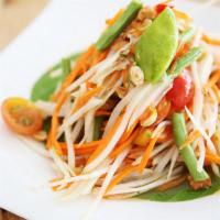Som Tum · Green papaya salad with peanuts, palm sugar, lemon juice, tomatoes and green beans.