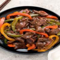 Pepper Steak · Sauteed flank steak, black pepper, onions, bell peppers, tomatoes and mixed vegetables.