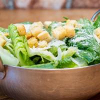 Caesar Salad · Crisp romaine, shaved Parmigiana, Romano and croutons.