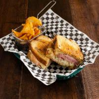 Rory's Reuben · Grilled marble rye piled high with fresh smoked corned beef brisket, Swiss cheese, sauerkrau...