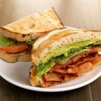 BLT Plus Sandwich · bacon, lettuce, tomatoes, cheddar, avocado, herb mayo on toasted sourdough & served with a s...